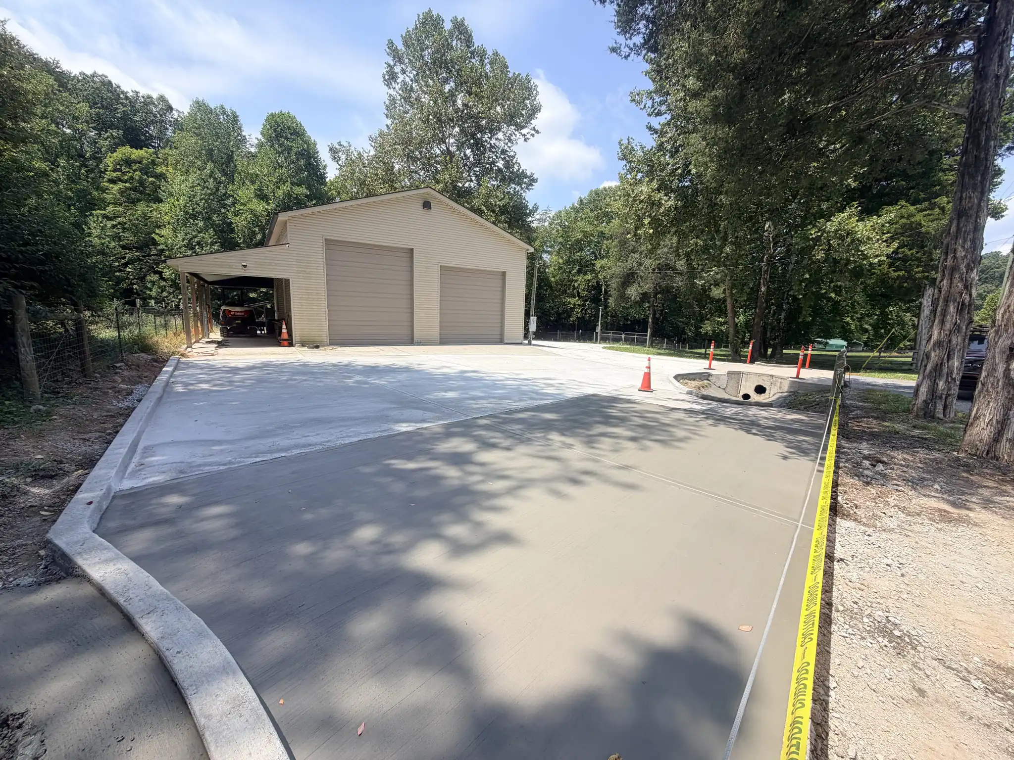 New concrete driveway poured up to a detached garage in Knoxville, Tennessee