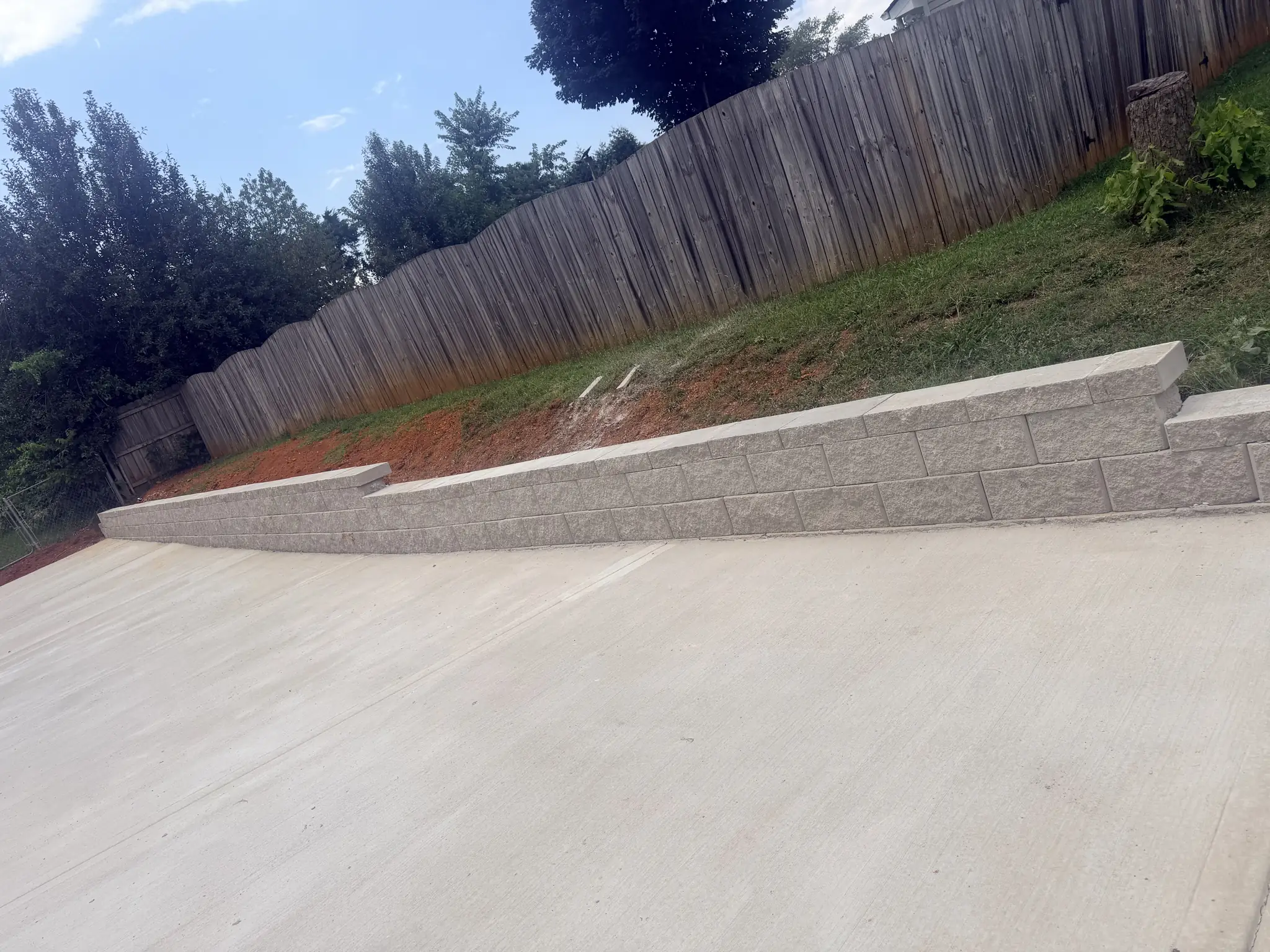 Keystone segmental retaining wall holding a bank back off a new concrete driveway in Knoxville, Tennessee